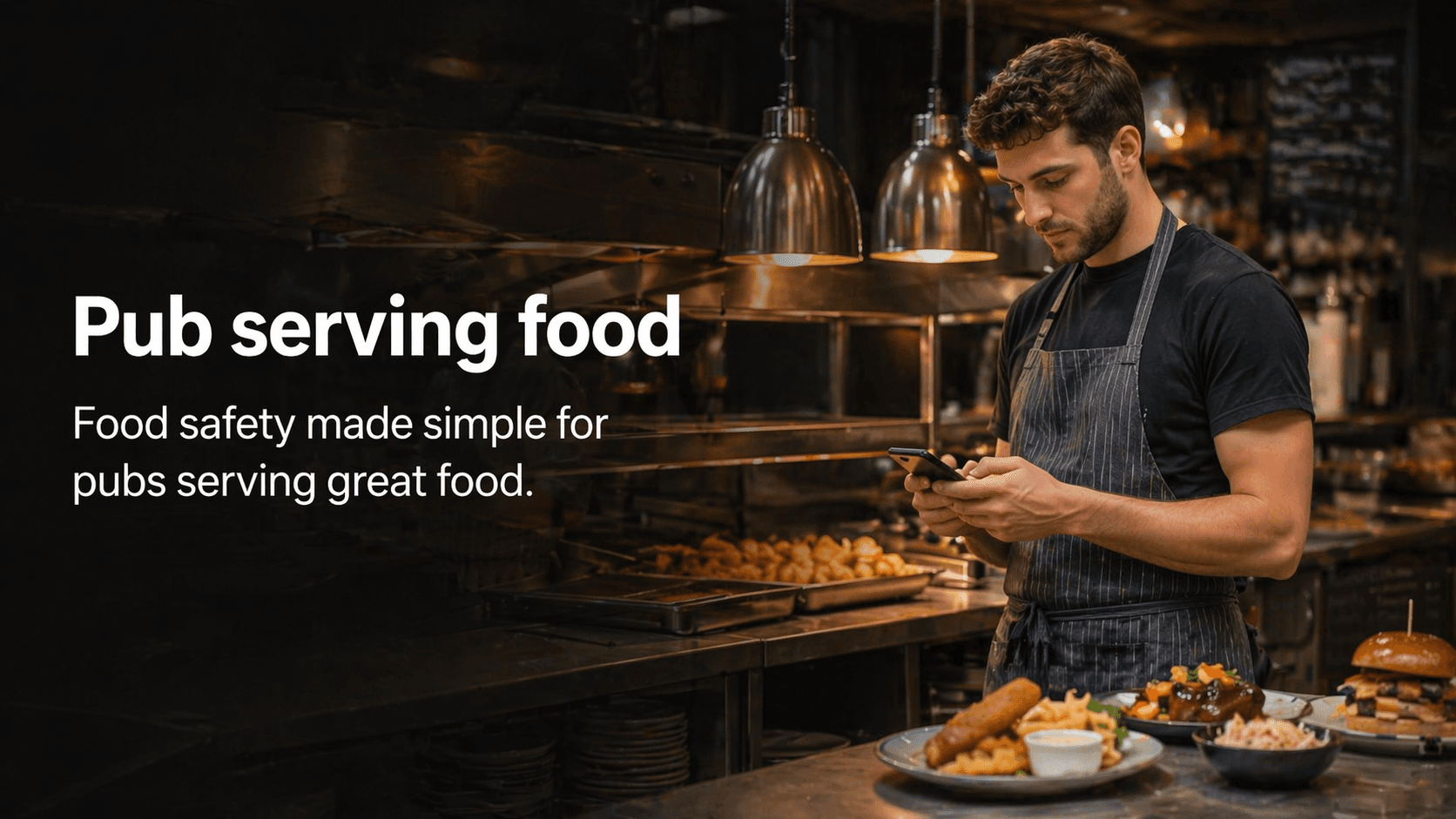 Pub kitchen staff member using a phone to complete a food safety check.